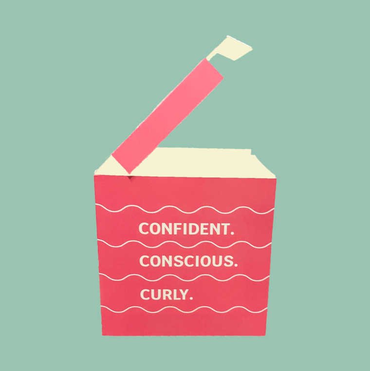 Side of a Curl carton reading Confident. Conscious. Curly.